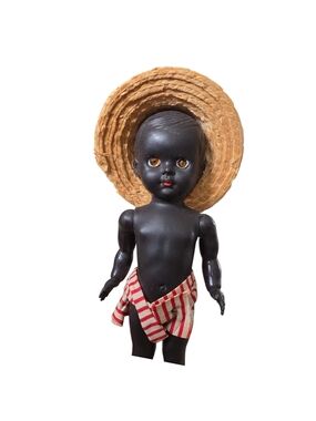 Vintage Black Plastic Doll with Straw Hat and Red-Striped Shorts